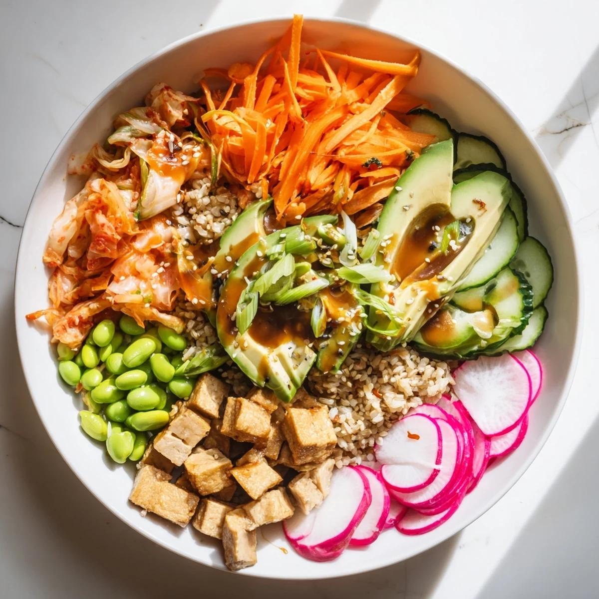 A colorful fermented vegetable bowl with vibrant kimchi and fresh greens.  