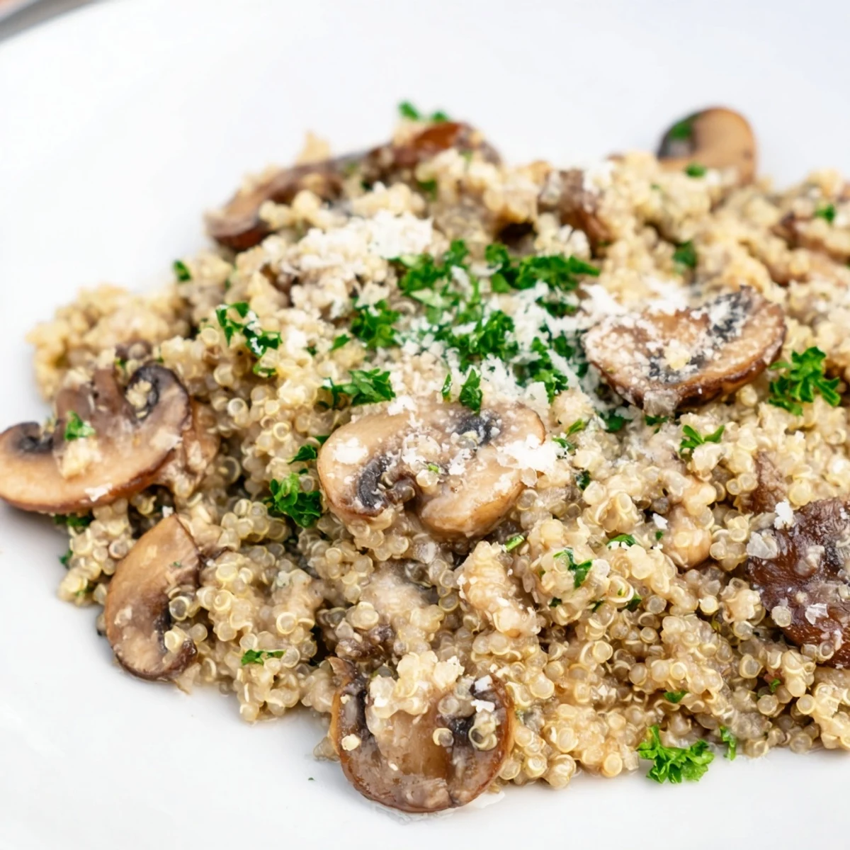 A comforting serving of vibrant Mushroom Quinoa Risotto, ready to be enjoyed as a hearty vegetarian meal.