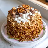 Stacked Haystack Candy Tower, a festive dessert, showcasing butterscotch, pretzels, and white chocolate.