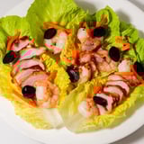 A festive Lunar New Year Dragon Platter featuring shrimp, char siu, and potstickers, artfully arranged.