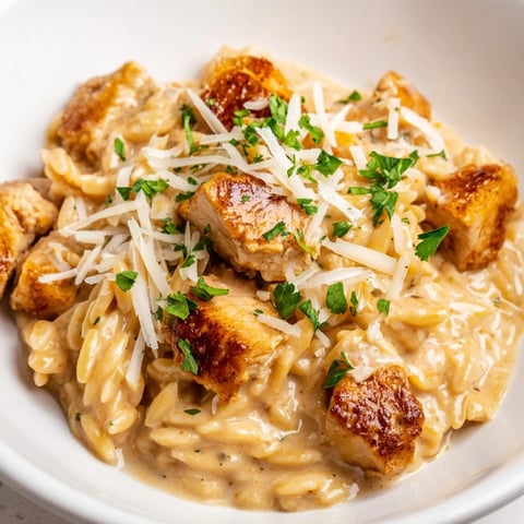 Creamy One-Pot Cajun Chicken Alfredo Orzo, with tender chicken and flavorful sauce, is ready in minutes!