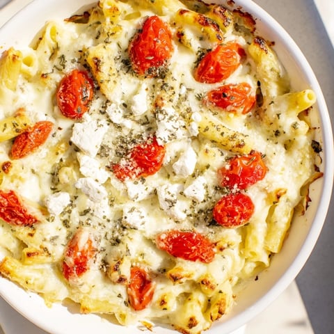 Four-Cheese Baked Block Pasta with bubbly cheese and roasted tomatoes, a perfect vegetarian meal.