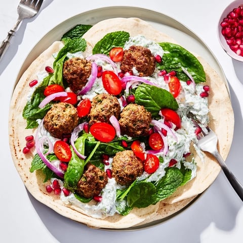 Festive Falafel & Tzatziki Christmas Wreath Wrap, a colorful and delicious vegetarian holiday main course.