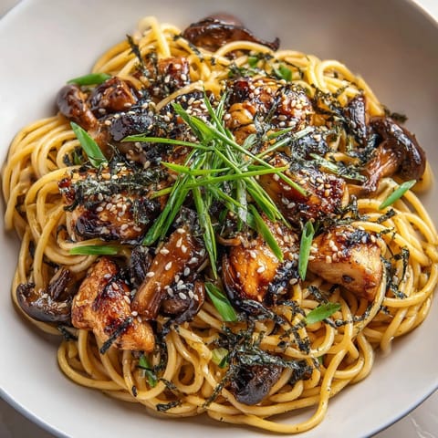 Tender teriyaki chicken over pasta, with glossy, sake-glazed shiitake, a truly delightful recipe.