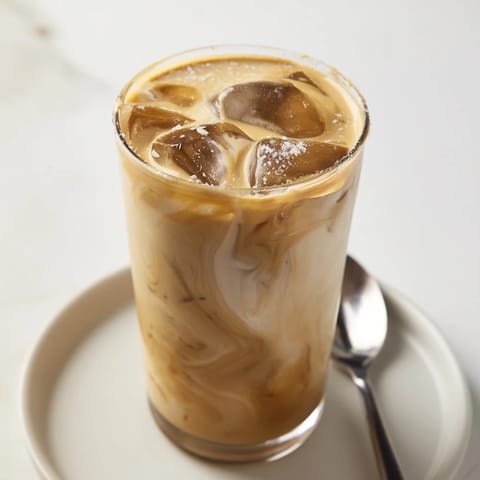 Rich and nutty tahini iced coffee served chilled in tall glasses, perfect for summer.  