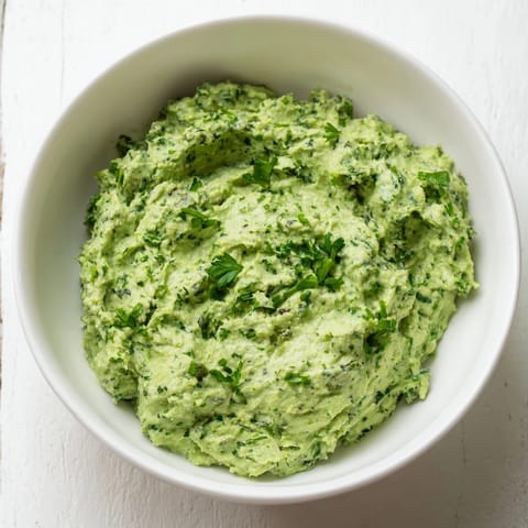 Vibrant swirls of creamy Green Goddess Dip, perfect as a dip or spread, made with fresh herbs.