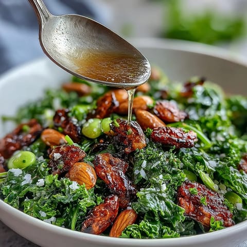 Vibrant spring green salad with honey mustard dressing, crunchy almonds, and fresh herbs—perfect for a light lunch or healthy appetizer.
