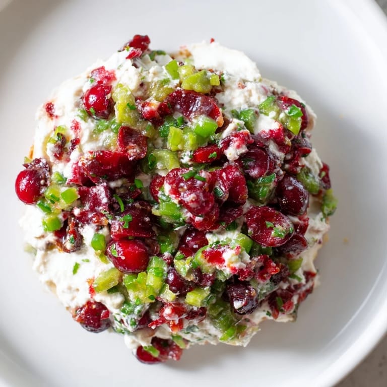 A vibrant bowl of Spicy Ginger Cranberry Jalapeño Dip, perfect for lively gatherings.  