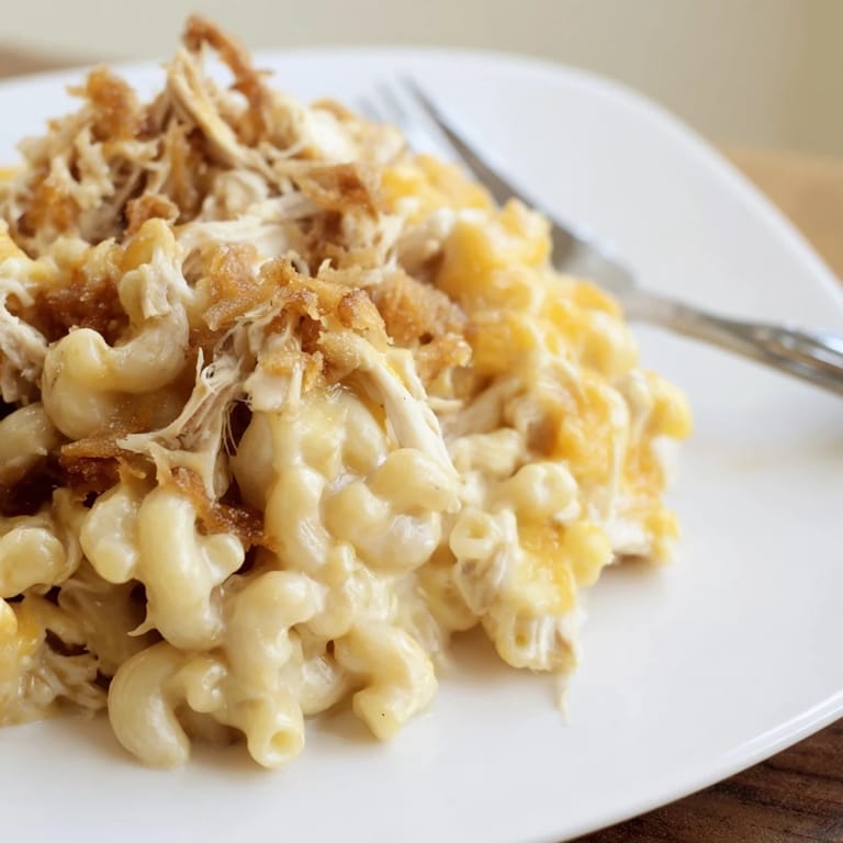 Savory Classic Mac & Cheese layered with tender barbecue chicken and crispy breadcrumbs.