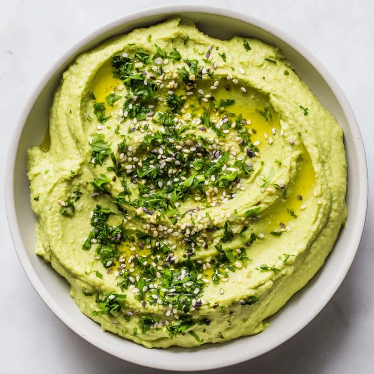 Freshly made Edamame Hummus, a bright green dip, is perfect for sharing at snack time with friends.